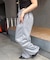 【continuer】キラキラロゴのスウェットパンツ