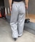 【continuer】キラキラロゴのスウェットパンツ