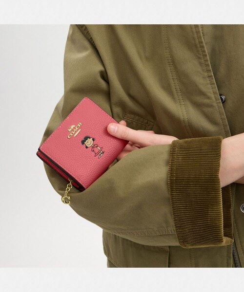 【Coach】Coach X Peanuts 可愛いルーシー♡ スナップ財布 COACH X PEANUTS】スナップ ウォレット・ルーシー|コーチ