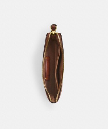 COACH X PEANUTS】コーナー ジップ リストレット・シグネチャー 