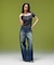 EMBLEM POCKET ASYMMETRIC WAIST DENIM PANTS