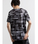 シェラック/SHELLAC メッセージ総柄グラフィック クルーネック半袖Tシャツ